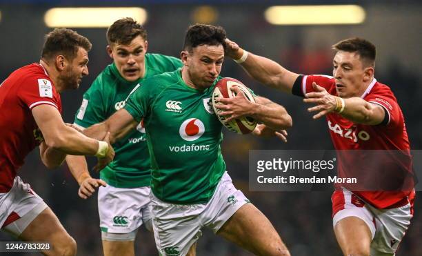 Wales , United Kingdom - 4 February 2023; Hugo Keenan of Ireland is tackled by Dan Biggar, left, and Josh Adams of Wales during the Guinness Six...