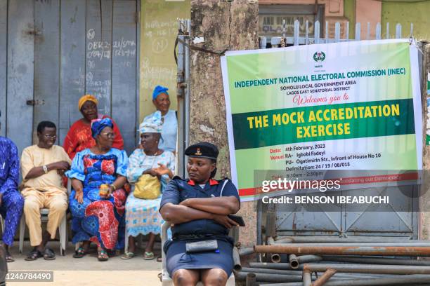 Security officer attends the mock accreditation exercise organised by the Independent National Electoral Commission at Somolu in Lagos, Nigeria on...