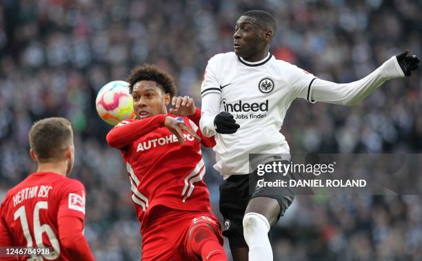 Frankfurt's French forward Randal Kolo Muani vies with Hertha Berlin's Dutch midfielder Jean-Paul Boetius and Hertha Berlin's English defender Jonjoe...