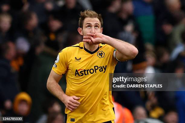 Wolverhampton Wanderers' English defender Craig Dawson celebrates after scoring his team's second goal during the English Premier League football...