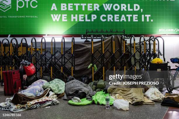 Homeless people stay warm at South Station, set up as as warming center, as temperatures reach -7F in Boston, Massachusetts, on February 4, 2023. -...