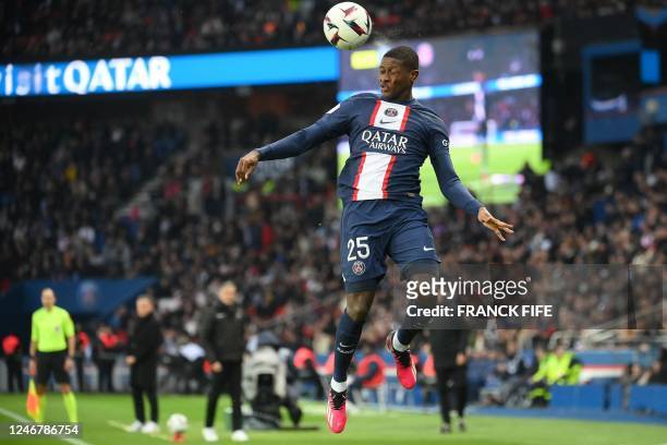 Paris Saint-Germain's Portuguese defender Nuno Mendes heads the ball during the French L1 football match between Paris Saint-Germain and Toulouse FC...