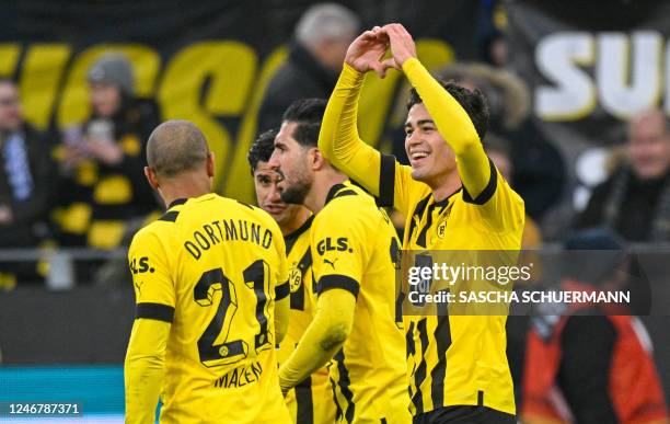 Dortmund's US midfielder Giovanni Reyna celebrates with teammates after scoring the 5-1 goal during the German first division Bundesliga football...