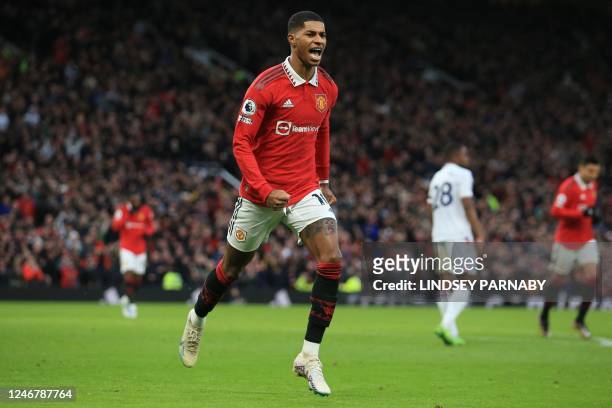 Manchester United's English striker Marcus Rashford celebrates after scoring his team's second goal during the English Premier League football match...