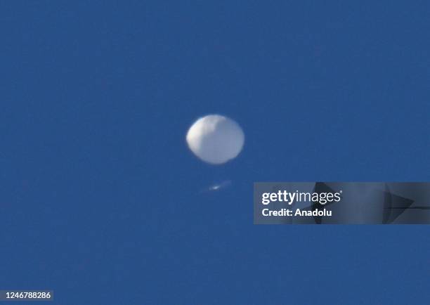 Chinese spy balloon flies above in Charlotte NC, United States on February 04, 2023. The Pentagon announced earlier that it is tracking a suspected...