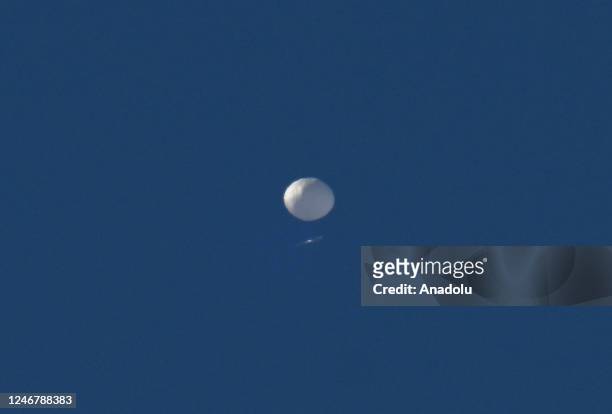 Chinese spy balloon flies above in Charlotte NC, United States on February 04, 2023. The Pentagon announced earlier that it is tracking a suspected...