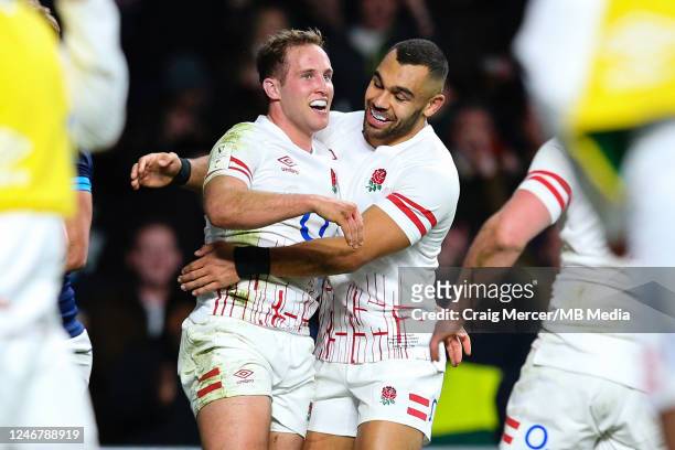 Max Malins of England celebrates scoring his sides first try with team mate Joe Marchant during the Six Nations Rugby match between England and...