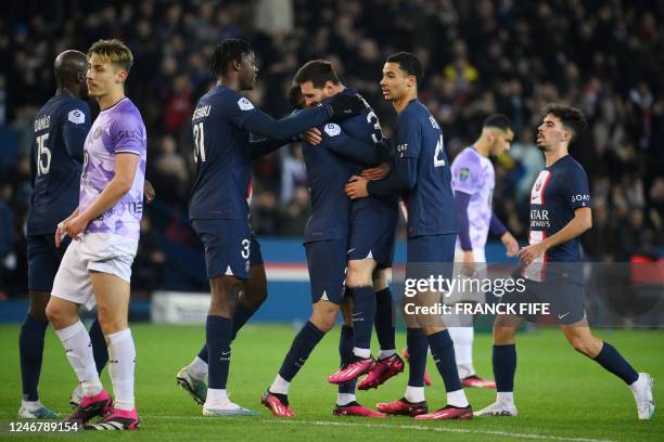 Paris Saint-Germain's Argentine forward Lionel Messi celebrates with teammates after scoring his team's second goal during the French L1 football...