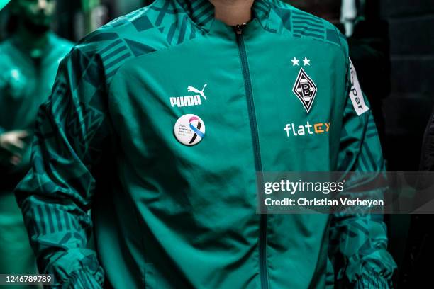 The Warm-Up-Jacket with the World-Cancer-Day-Badge is seen ahead of the Bundesliga match between Borussia Moenchengladbach and FC Schalke 04 at...