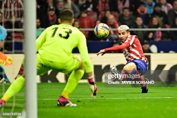 Atletico Madrid's Argentinian forward Angel Correa kicks the ball during the Spanish league football match between Club Atletico de Madrid and Getafe...