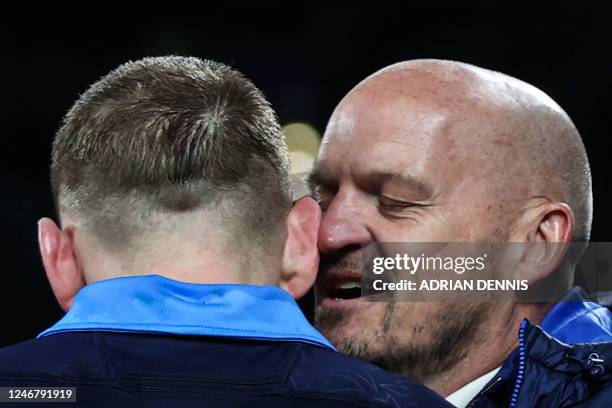 Scotland head coach Gregor Townsend congratulates Scotland's scrum-half Finn Russell after winning at the end of the Six Nations international rugby...