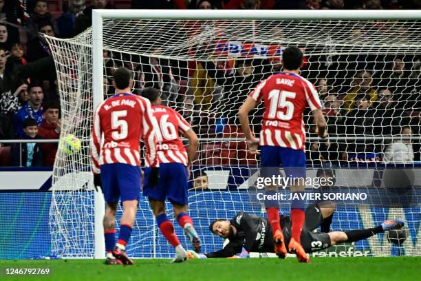 Atletico Madrid's Slovenian goalkeeper Jan Oblak fails to stop the ball during the Spanish league football match between Club Atletico de Madrid and...