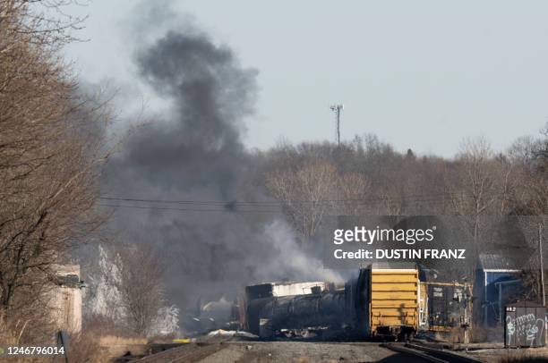 Smoke rises from a derailed cargo train in East Palestine, Ohio, on February 4, 2023. - The train accident sparked a massive fire and evacuation...