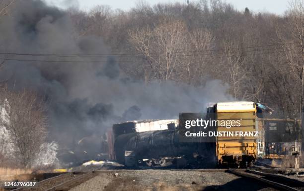 Smoke rises from a derailed cargo train in East Palestine, Ohio, on February 4, 2023. - The train accident sparked a massive fire and evacuation...