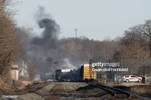 Smoke rises from a derailed cargo train in East Palestine, Ohio, on February 4, 2023. - The train accident sparked a massive fire and evacuation...