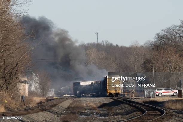 Smoke rises from a derailed cargo train in East Palestine, Ohio, on February 4, 2023. - The train accident sparked a massive fire and evacuation...