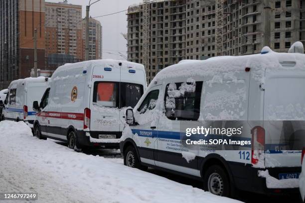 Police car and an ambulance seen are parked on the street in St. Petersburg.