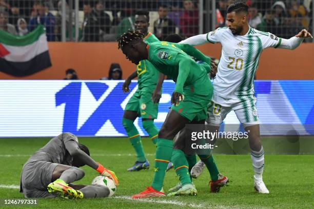 Senegal's goalkeeper Pape Mamadou Sy gathers the ball during the 2022 African Nations Championship final football match between Algeria and Senegal...