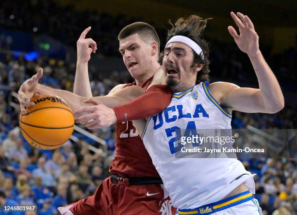 Andrej Jakimovski of the Washington State Cougars and Jaime Jaquez Jr. #24 of the UCLA Bruins battle for a rebound in the first half at UCLA Pauley...