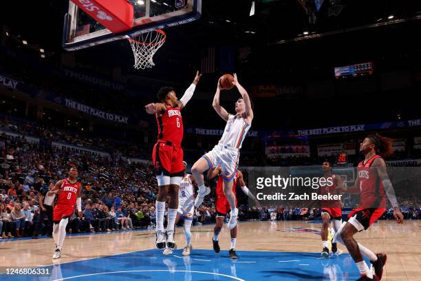 Josh Giddey of the Oklahoma City Thunder drives to the basket against the Houston Rockets on February 4, 2023 at Paycom Arena in Oklahoma City,...
