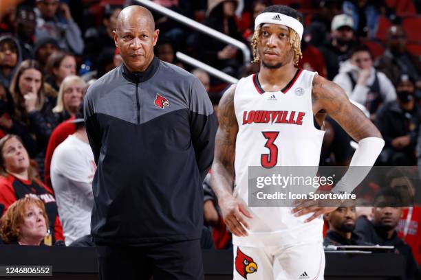 Louisville Cardinals head coach Kenny Payne and guard El Ellis look on during a college basketball game against the Florida State Seminoles on...