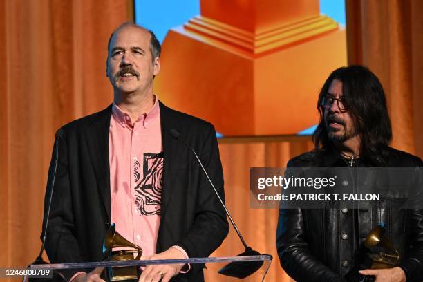 Musicians Krist Novoselic and Dave Grohl receive the Lifetime Achievement Award for Nirvana during the Recording Academys Special Merit Awards at the...