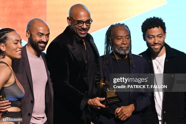 Lifetime Achievement Award honoree US jazz vocalist Bobby McFerrin accepts his award from Harvey Mason Jr., CEO of The Recording Academy , during the...