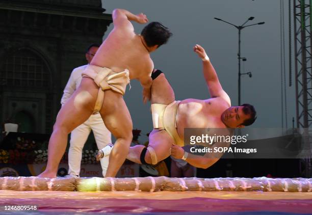 Japanese Sumo wrestlers demonstrate a wrestling move at the signing of Memorandom Of Understanding between Maharashtra and Japan's Wakayama...