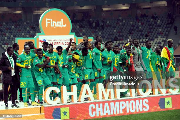 Players of Senegal celebrate their victory at the end of the 7th African Nations Championship Final match between Algeria and Senegal at Nelson...