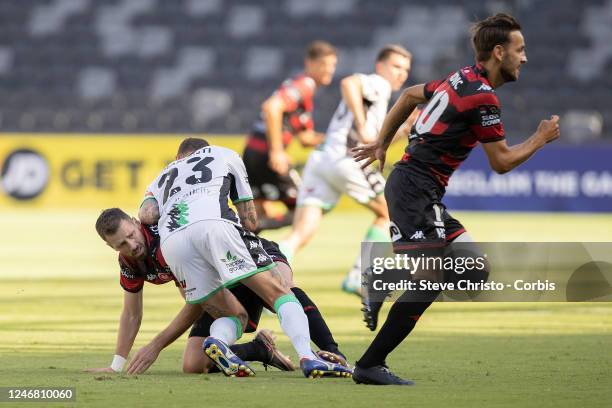 Morgan Schneiderlin of the Wanderers is pushed down by Alessandro Diamanti of United during the round 15 A-League Men's match between Western Sydney...