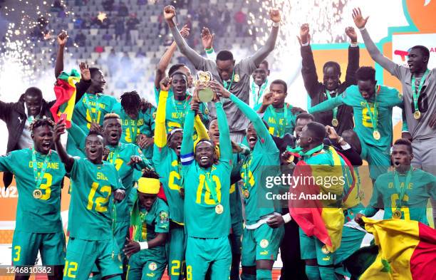Players of Senegal celebrate their victory after the 7th African Nations Championship Final match between Algeria and Senegal at Nelson Mandela...