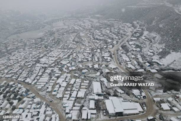 An aerial picture shows snow covering a camp for internally displaced Syrians in the Khirbet al-Joz area, in the west of the northwestern Idlib...