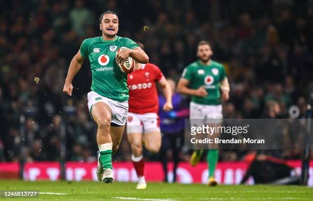 Wales , United Kingdom - 4 February 2023; James Lowe of Ireland races clear on the way to scoring his side's third try during the Guinness Six...
