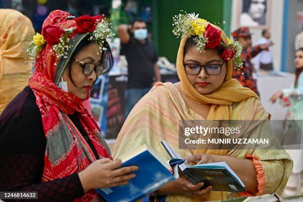 Visitors browse books at the national book fair in Dhaka on February 5, 2023.