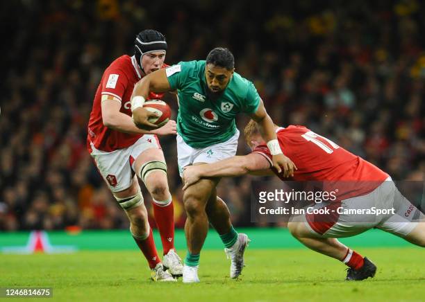 Bundee Aki of Ireland takes on Rhys Carré of Wales during the Six Nations Rugby match between Wales and Ireland at Principality Stadium on February...