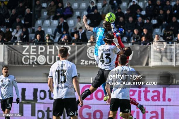 Napoli's Nigerian forward Victor Osimhen scores a header and his team's second goal during the Italian Serie A football match between Spezia and...