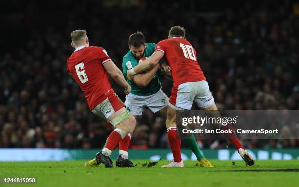 Stuart McCloskey of Ireland is tackled by Dan Biggar of Wales during the Six Nations Rugby match between Wales and Ireland at Principality Stadium on...