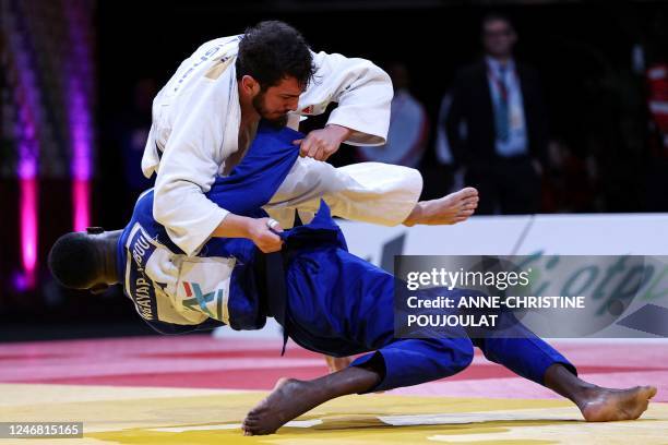 France's Maxime-Gael Ngayap Hambou and Georgia's Lasha Bekauri compete during their men's -90kg category bout at the Paris Grand Slam judo tournament...