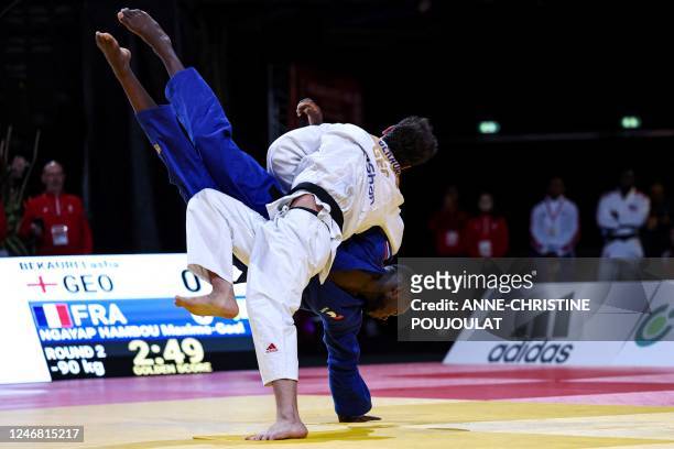 France's Maxime-Gael Ngayap Hambou and Georgia's Lasha Bekauri compete during their men's -90kg category bout at the Paris Grand Slam judo tournament...