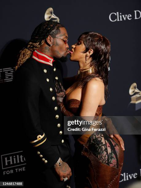 Cardi B. And Offset steal a kiss on the Red Carpet before the Pre-Grammy Gala at the Beverly Hilton on February 4, 2023 in Beverly Hills, California.