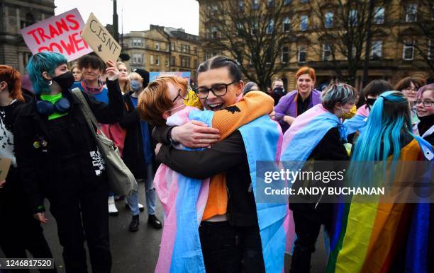 Trans Rights activists react while taking part in the "Furies against Fascism" counter protest to the "Let Women Speak" rally in Glasgow, on February...