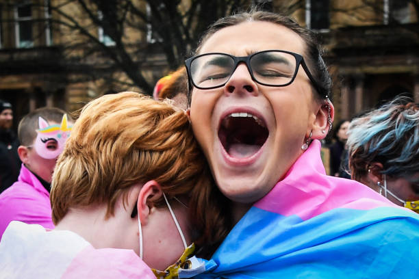 Trans Rights activists react while taking part in the "Furies against Fascism" counter protest to the "Let Women Speak" rally in Glasgow, on February...