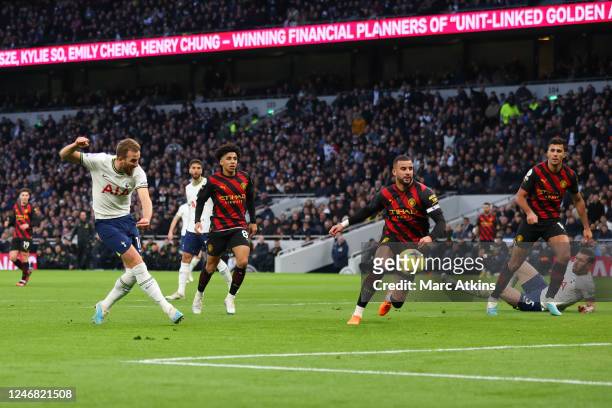 Harry Kane of Tottenham Hotspur scores the opening goal during the Premier League match between Tottenham Hotspur and Manchester City at Tottenham...