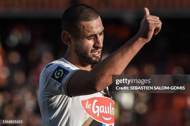 Angers' Algerian defender Faouzi Ghoulam gives the thumbs-up at the end of the French L1 football match between FC Lorient and Angers at Stade du...