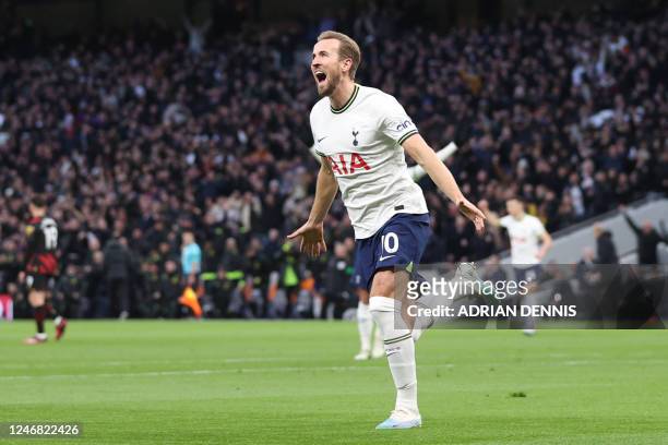 Tottenham Hotspur's English striker Harry Kane celebrates after scoring his team first goal during the English Premier League football match between...