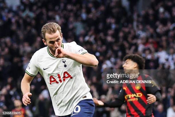 Tottenham Hotspur's English striker Harry Kane celebrates after scoring his team first goal during the English Premier League football match between...