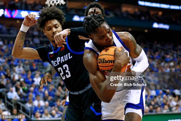 Ndefo of the Seton Hall Pirates wrestles the ball away from Caleb Murphy of the DePaul Blue Demons during the first half of a game at Prudential...