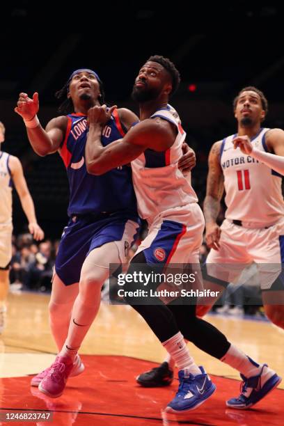 David Nwaba of the Motor City Cruise and David Duke Jr. #6 of the Long Island Nets fight for a rebound during the game on February 4, 2023 in...