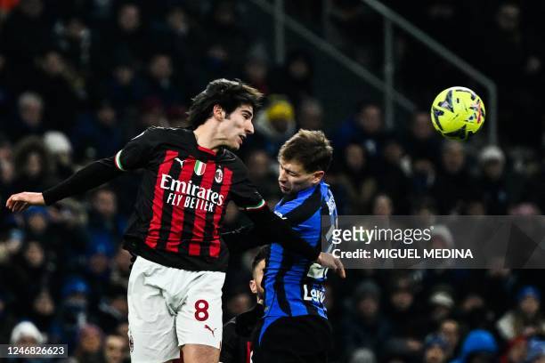 Milan's Italian midfielder Sandro Tonali and Inter Milan's Italian midfielder Nicolo Barella go for a header during the Italian Serie A football...