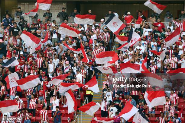 Fans of Chivas cheers for their team during the 5th round match between Chivas and Queretaro as part of the Torneo Clausura 2023 Liga MX at Akron...